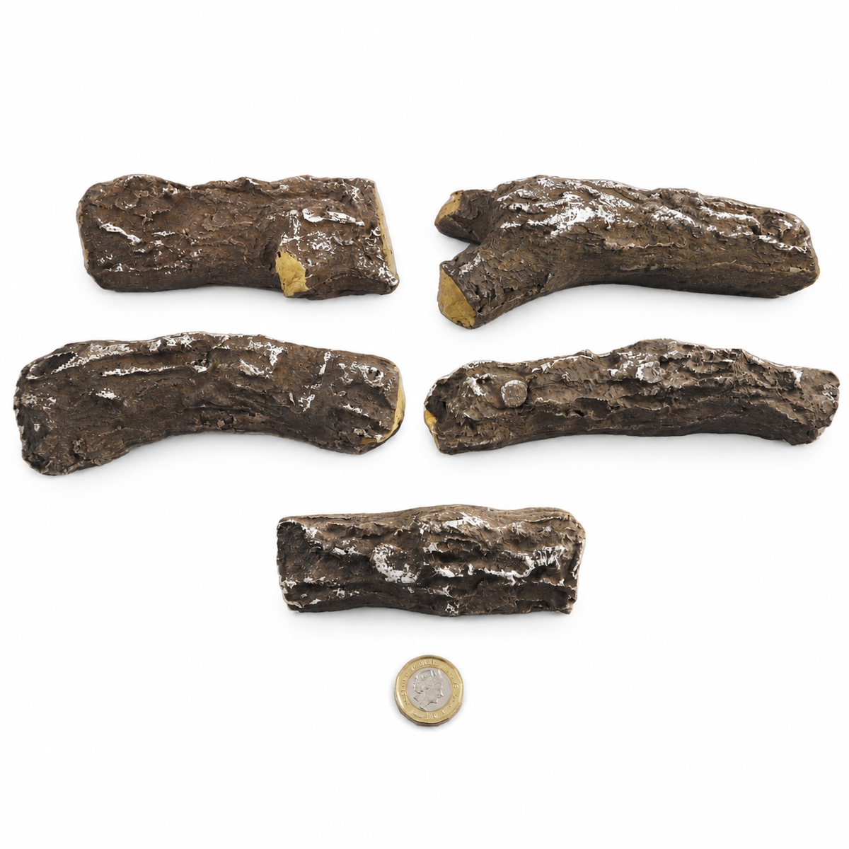 5 Piece Delamere ceramic gas fire logs laid out individually with a £1 coin for scale