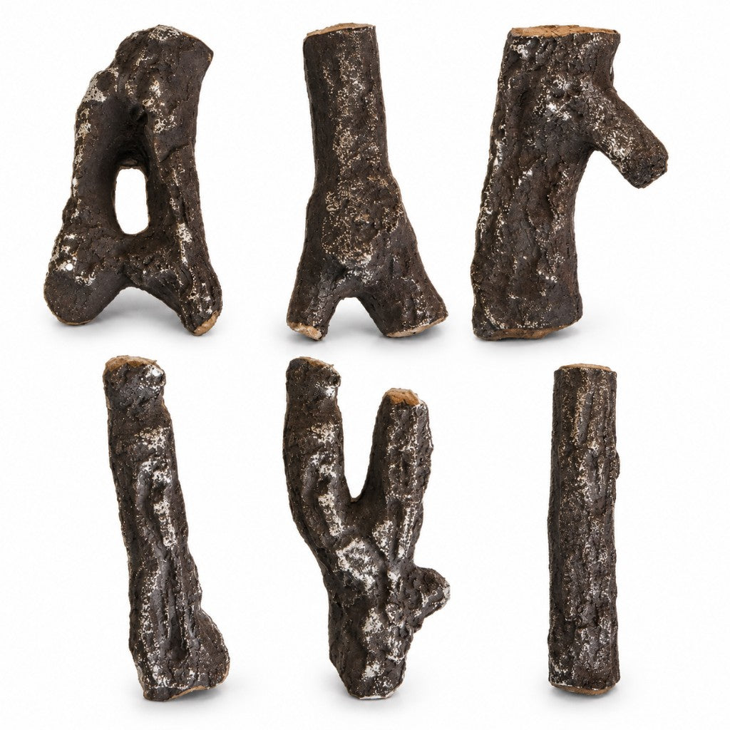 Six individual Wesley ceramic gas fire log shapes laid out on a white background