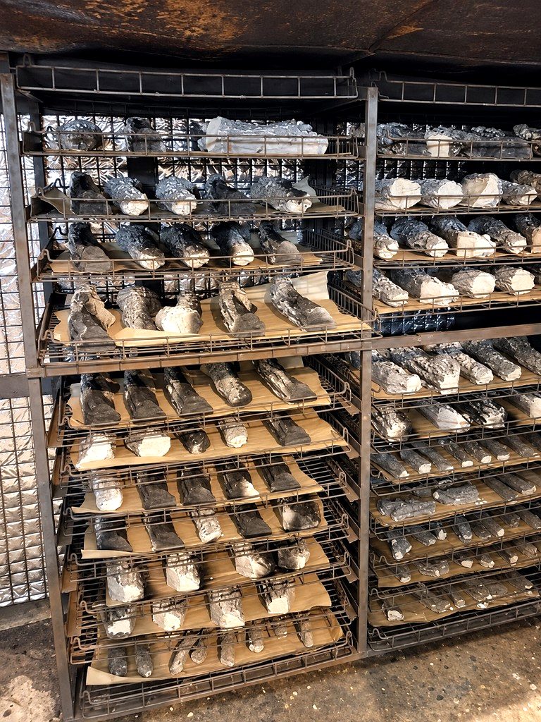 Ceramic logs manufactured in Flint by The Stove Wizard for Game of Thrones, drying on factory racks.
